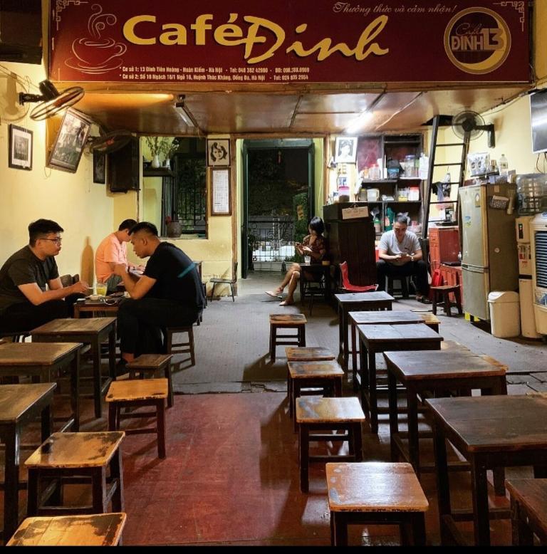 The café itself has an old-world charm, with wooden furniture, low lighting, and a cozy atmosphere