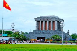 The mausoleum is surrounded by well-kept lawns and fragrant flower beds