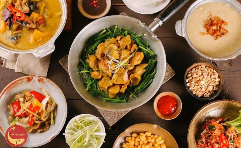 A vibrant plate of Cha Ca with turmeric-marinated fish, dill, and rice noodles.