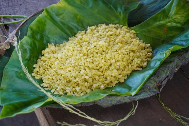 Com (young sticky rice) is a type of young sticky rice that is harvested when the grains are still green and tender.