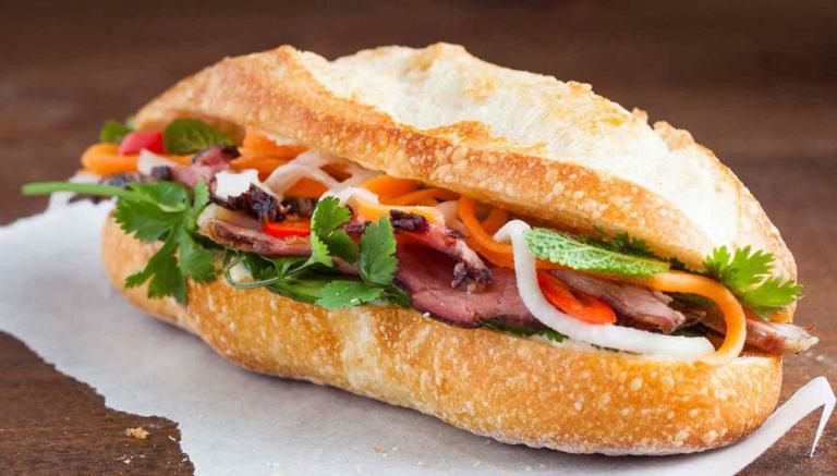 Banh Mi with assorted fillings on a rustic wooden table