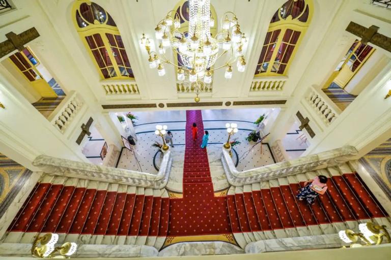 One cannot miss the grand staircase that leads to the main entrance—an eye-catching feature that exudes elegance.