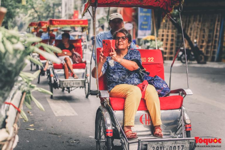 Cyclos, or bicycle rickshaws, are a quintessential part of Hanoi's transportation scene.