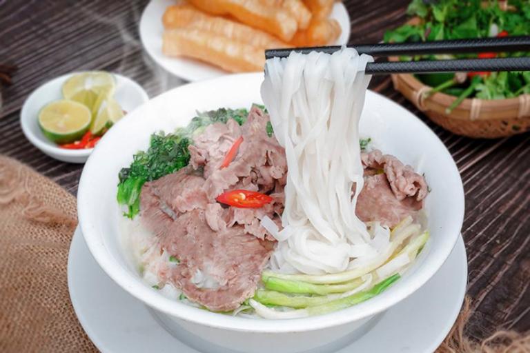 This hearty noodle soup is made with a flavorful broth, rice noodles, thinly sliced beef or chicken, and fresh herbs. 