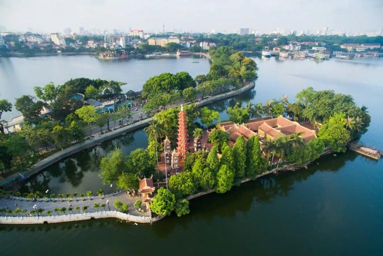 The Tran Quoc Pagoda is likened to a "precious gem" that adorns the lovely West Lake setting.