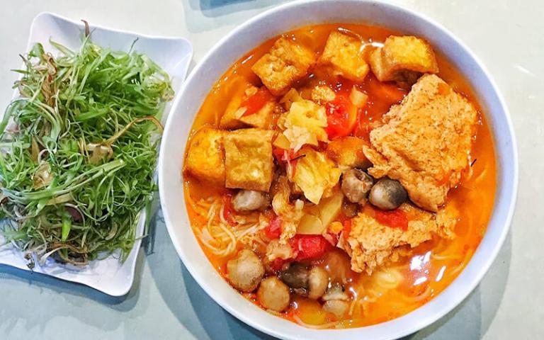 Bun Rieu can be made vegetarian by using tofu and tomatoes to create the base of the broth.