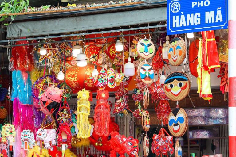 Hang Ma Street is a bustling marketplace brimming with vibrant decorations, traditional handicrafts