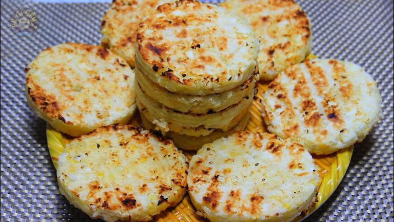 Banh Khoai Mi Nuong is a dense, chewy cake made from grated cassava, coconut milk, and sugar.