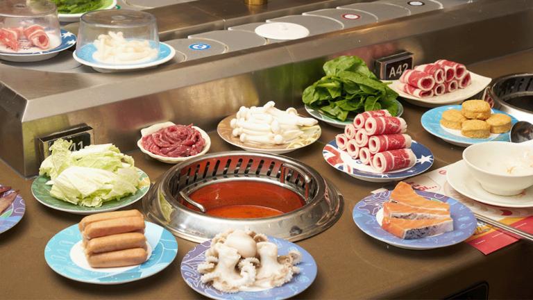 Kichi-Kichi revolutionizes the hotpot experience with its unique conveyor belt service.