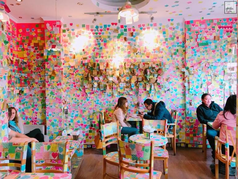 The Note Coffee stands out with its colorful post-it notes left by customers in various languages