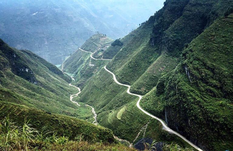 Travel from Hanoi to Ha Giang by overnight bus to reach Cave.