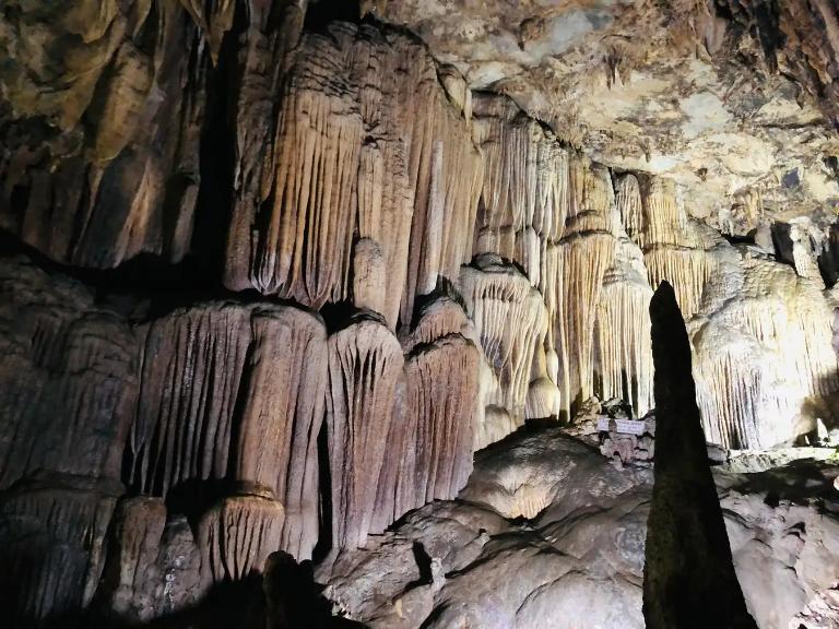 Lung Khuy Cave's vast halls and towering ceilings create an awe-inspiring experience.