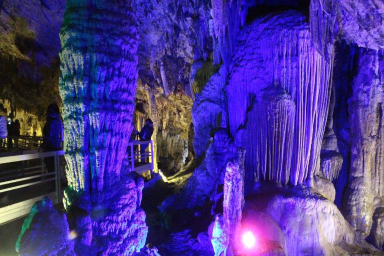 Lung Khuy Cave's small, hidden entrance blends into lush greenery.