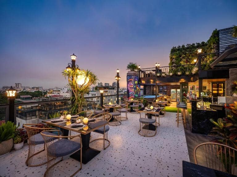 The rooftop bar provides the perfect setting for evening drinks with stunning city views.