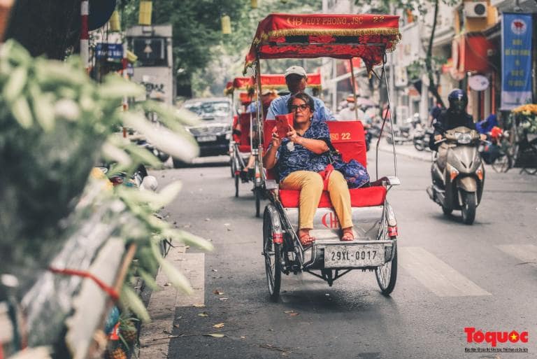 Take a Cyclo Ride Around the Old Quarter for a traditional experience through Hanoi’s bustling streets and alleys.