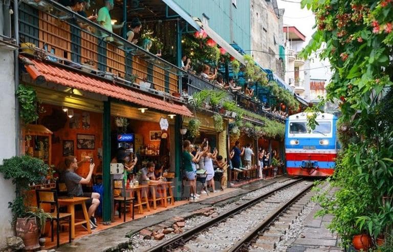 Cafe Hanoi Train Street is one of the best things to do in Hanoi, where you can sip coffee while trains pass by just inches away.