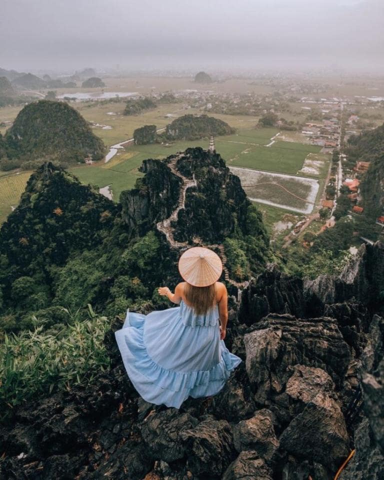 Walk and enjoy the sunset at the peak of Ngoa Long Mountain, offering breathtaking views of Tam Coc Valley.