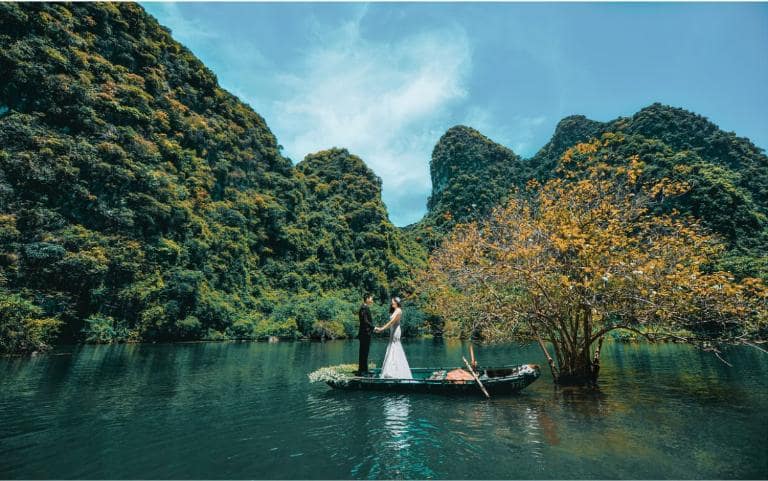 Enjoy the scenery at Dong Chuong Lake, a peaceful retreat surrounded by pine trees, perfect for fishing or boating.