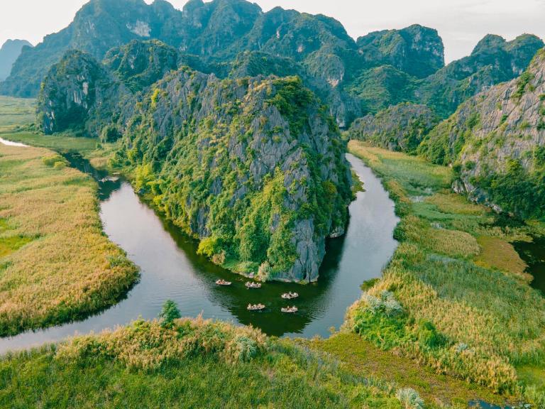 Cruise through the Van Long Wetland Reserve to admire Vietnam’s natural beauty and spot over 40 bird species.