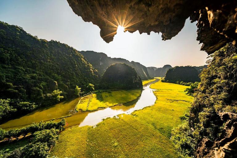 Explore Tam Coc – Bich Dong, where you can paddle through lush rice paddies and towering limestone peaks.