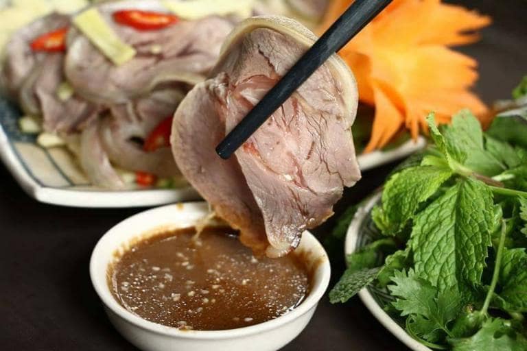 Taste Ninh Binh specialties like mountain goat and crispy burnt rice, which are loved by both locals and tourists.