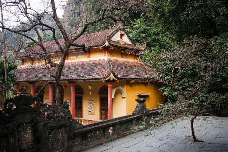 Trung Pagoda, 120 steps above, offers serene meditation and breathtaking natural views.