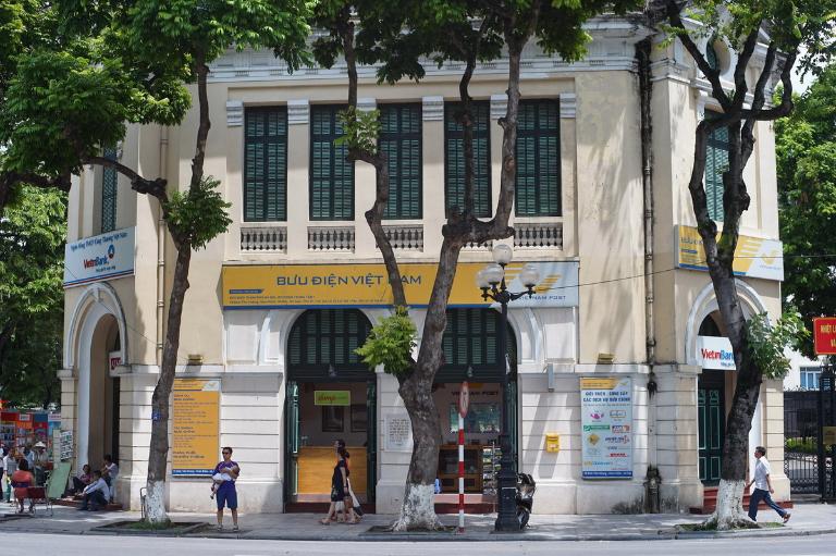 The building’s unique architectural features, such as its grand arches and intricate details, showcase a fusion of French and Vietnamese styles.