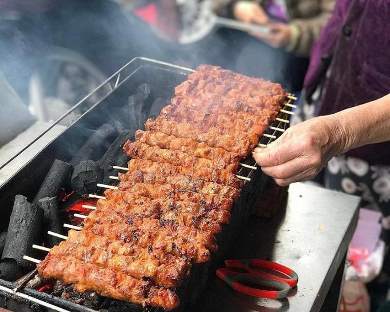 Grilled Meat Skewers are a must-try on your Hanoi walking food tour for a tasty experience.