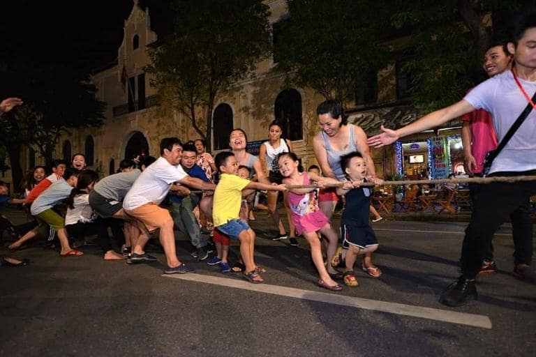 At Hanoi Walking Street, you can enjoy playing traditional Vietnamese games, offering a unique cultural experience.