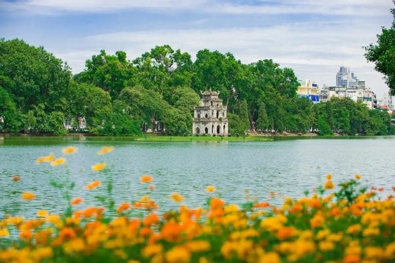 Hanoi Walking Street is located next to Hoan Kiem Lake, offering a stunning view of the iconic Turtle Tower.