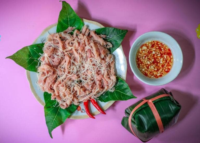 Nem chua Yen Mac is a fermented pork delicacy wrapped in guava leaves, offering a tangy and unique taste.