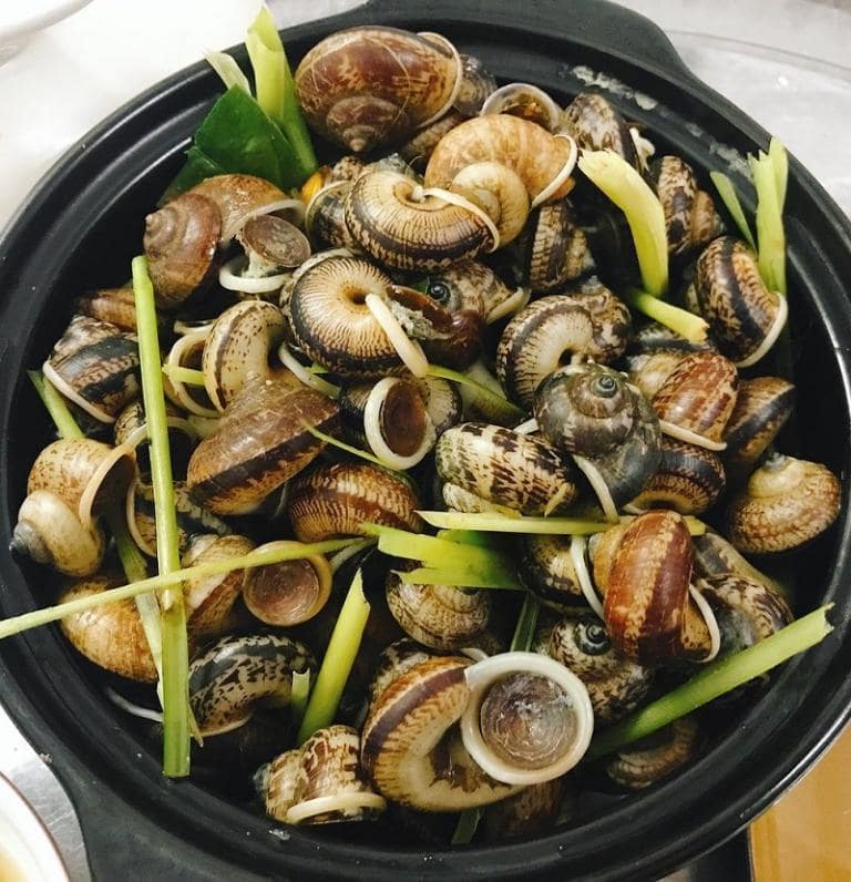 Ninh Binh mountain snails are a seasonal delicacy, often stir-fried with lemongrass and chili for a spicy kick.