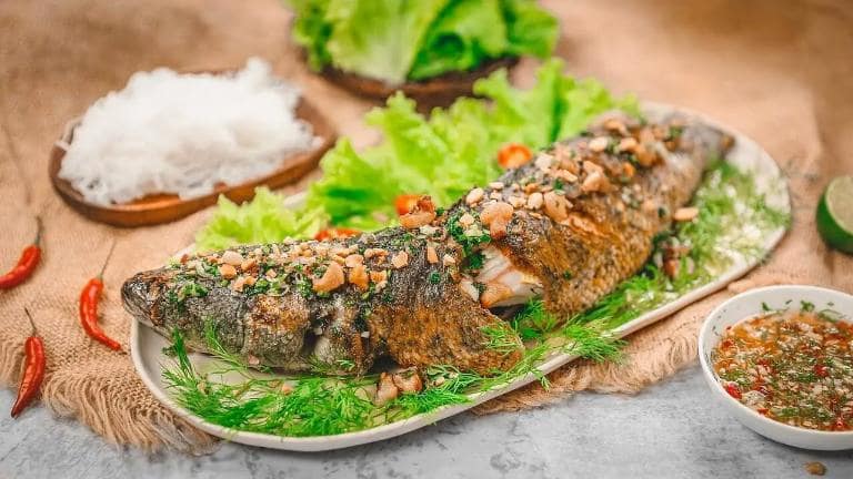 Ninh Binh grilled banana fish is marinated to perfection and grilled over charcoal for a smoky, succulent taste.