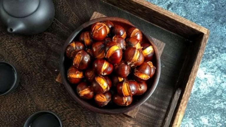 Warm roasted chestnuts fill Sapa's chilly streets, offering a comforting winter snack.