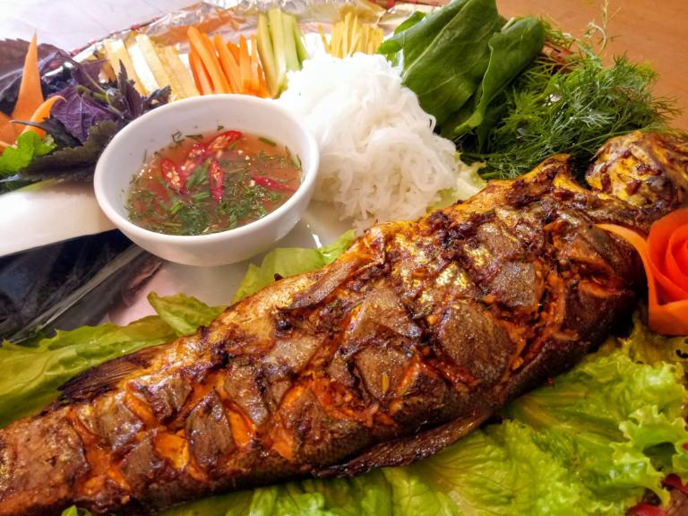 Grilled stream fish is seasoned to perfection, showcasing Sapa's fresh mountain waters.