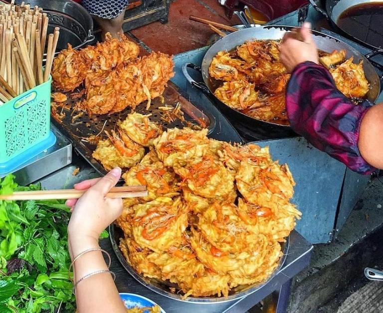 Explore Hanoi's vibrant street food scene on a walking food tour, sampling delicious local dishes.