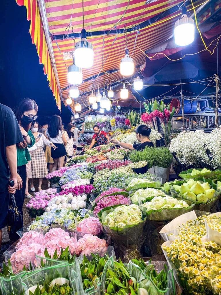 Quang Ba Flower Market in Hanoi: a vibrant display of colorful blooms, bustling with activity