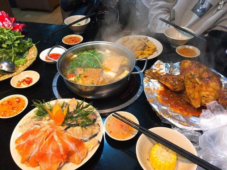 Fresh salmon slices, veggies, and tofu simmer in a tangy broth for Sapa's signature hotpot dish