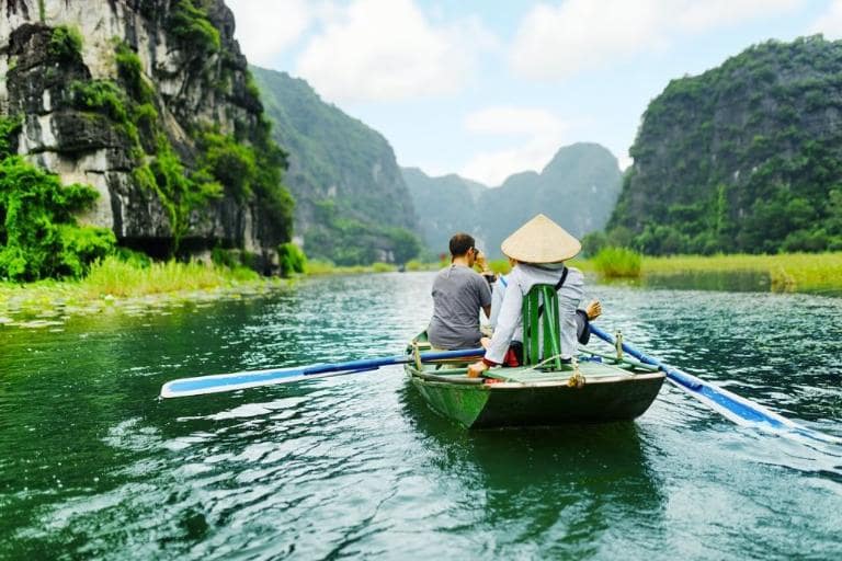 Admire rowers who paddle with their feet, a traditional skill that ensures smooth navigation of the river.