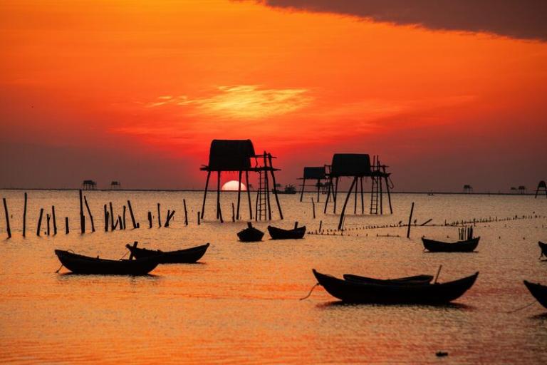 Dong Chau Beach offers seafood, local delights, scenic strolls, and stunning sunrises, perfect for photos.