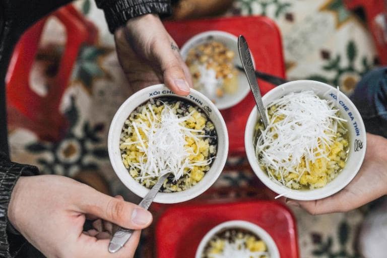 Che is a popular Hanoi street snack, made from beans, fruits, and coconut milk for a refreshing treat.