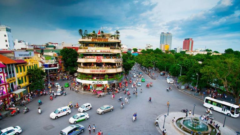 A street in Hanoi, Vietnam, showing local shops, pedestrians, and the city’s unique atmosphere.