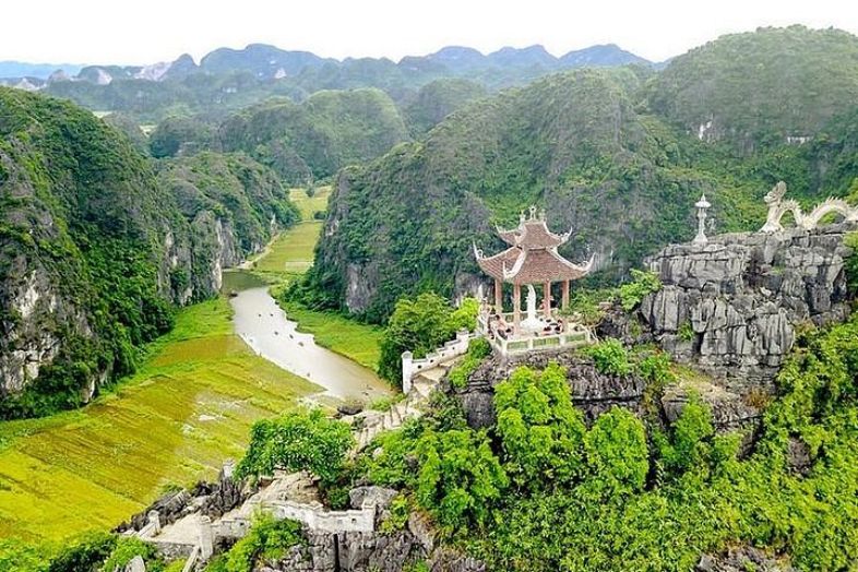 Panoramic view from Mua Cave viewpoint overlooking the limestone mountains and river valleys of Tam Coc in Ninh Binh.