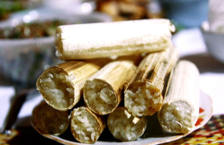 Bamboo rice, cooked in fresh bamboo tubes, is sweet, sticky, and often served with roasted meats.