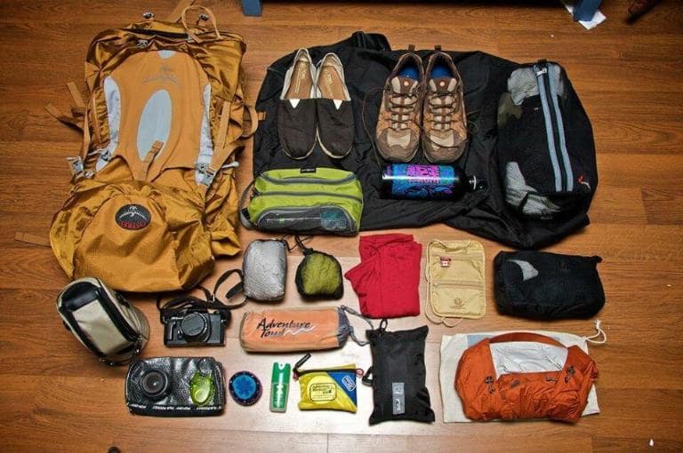 Pack essential trekking gear, including a waterproof backpack and rain cover.