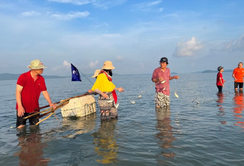 Fishing at Quan Lan Beach
