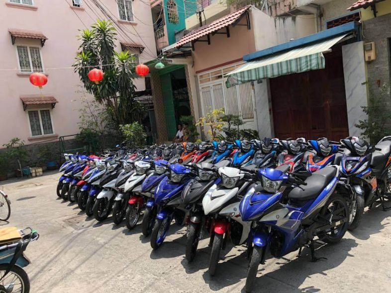 A row of motorbikes available for rent in Vietnam, ready for travelers to explore the streets and countryside.