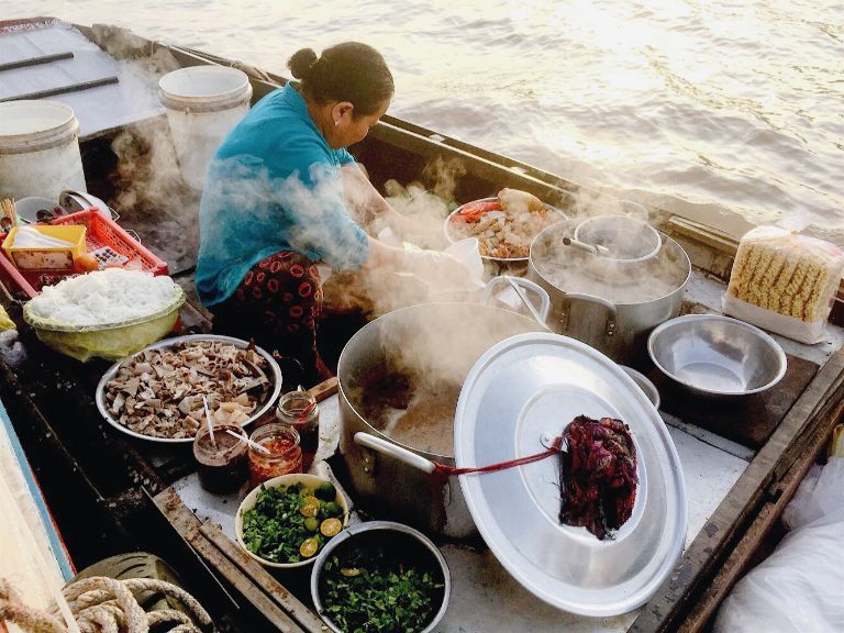Hand-pounded squid cake demonstrates the traditional craftsmanship behind Halong’s iconic dishes.