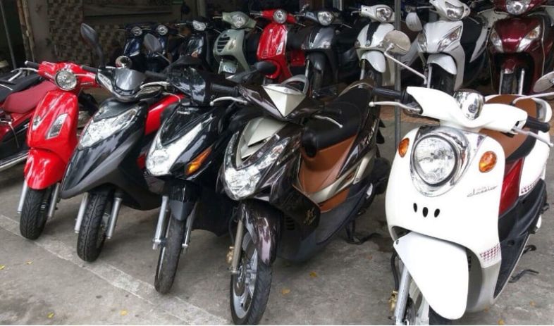 Motorbikes lined up for rent in Hai Phong, Vietnam, ready for tourists to explore the urban and coastal areas.